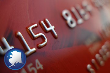 a credit card macro photo - with Alaska icon