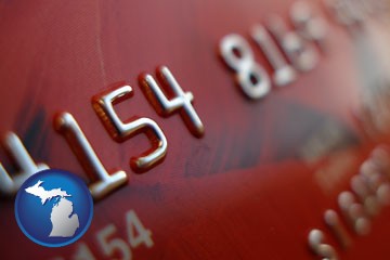 a credit card macro photo - with Michigan icon