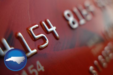 a credit card macro photo - with North Carolina icon
